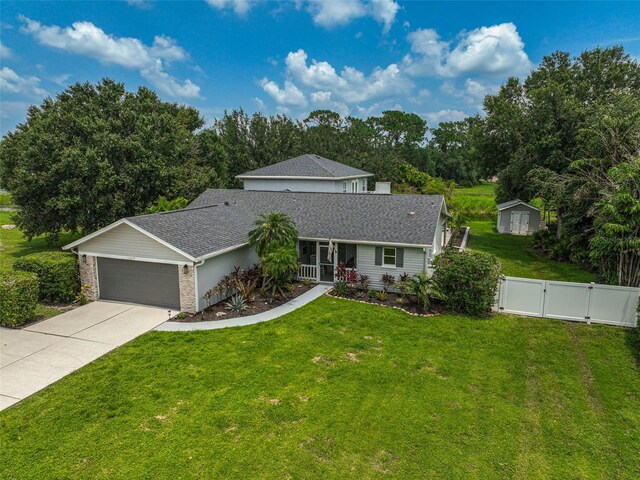 view of front facade with a garage and a front lawn