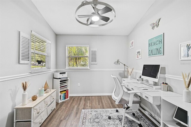 office with ceiling fan, vaulted ceiling, and hardwood / wood-style flooring