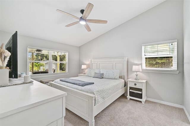 carpeted bedroom featuring ceiling fan and lofted ceiling