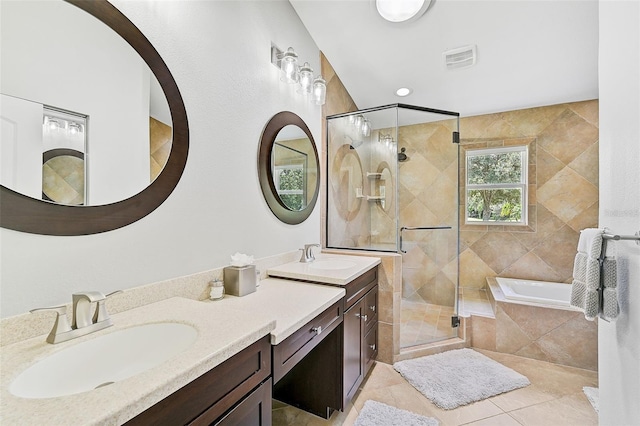 bathroom featuring tile patterned floors, vanity, and independent shower and bath