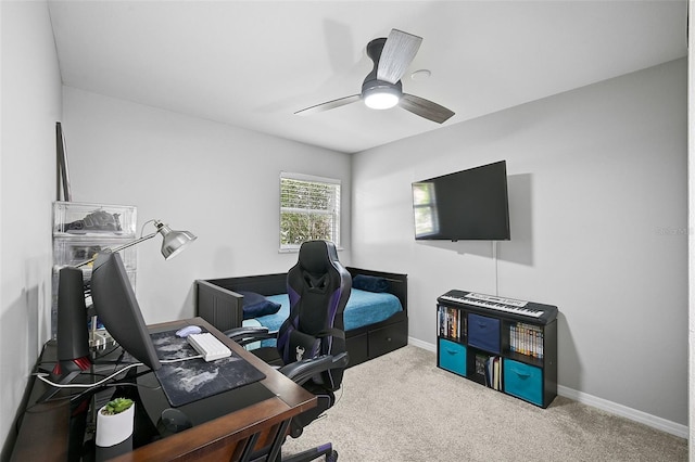 home office featuring carpet flooring and ceiling fan