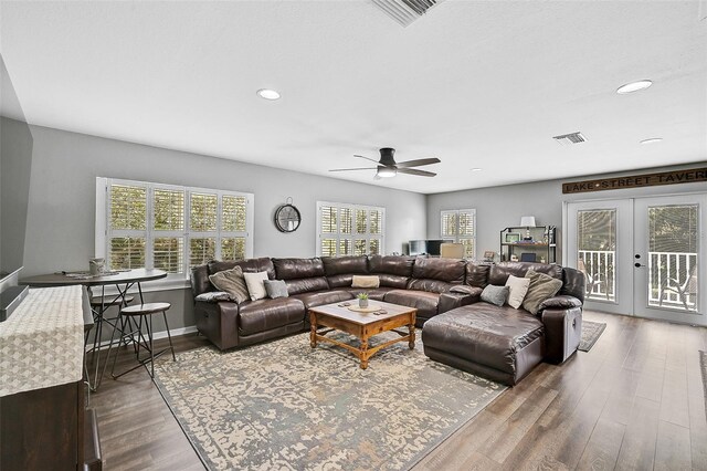 living room featuring ceiling fan, french doors, and hardwood / wood-style floors