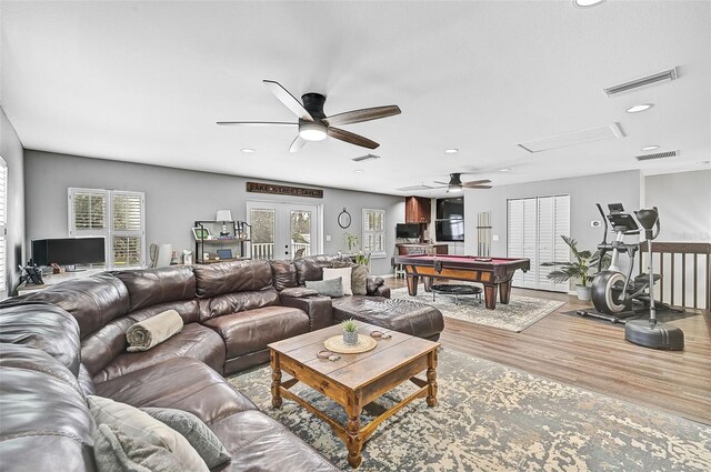 living room with french doors, hardwood / wood-style flooring, a wealth of natural light, and pool table