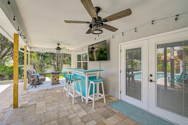 view of patio with a bar and french doors