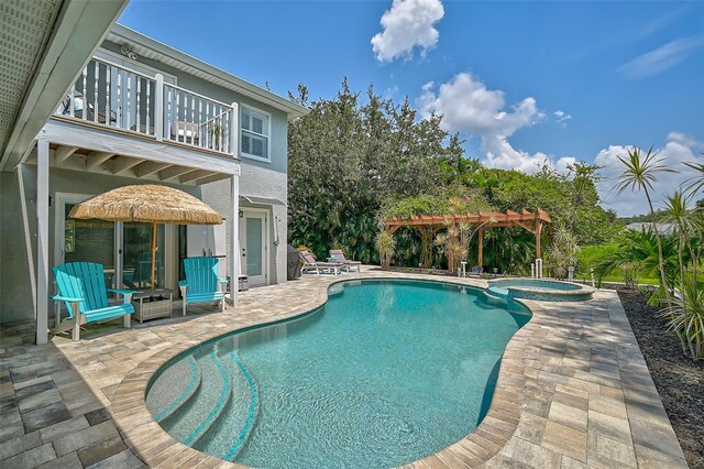 view of pool with a pergola, an in ground hot tub, and a patio