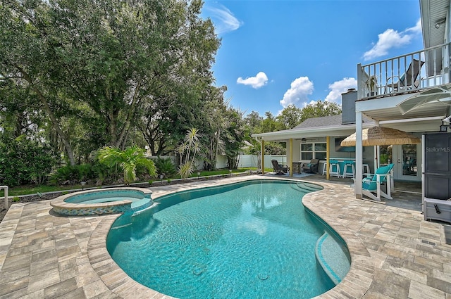 view of swimming pool with an in ground hot tub, a patio, and an outdoor bar