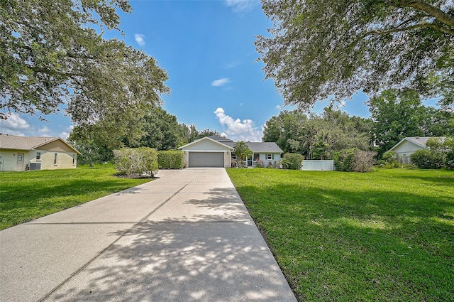 ranch-style home with a garage and a front lawn