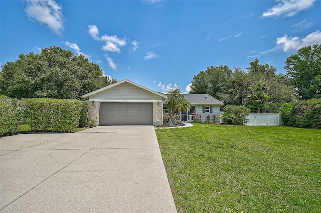 view of front facade featuring a front yard and a garage