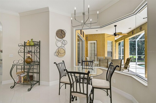 dining space with crown molding and ceiling fan with notable chandelier