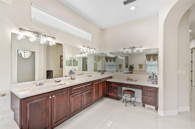 bathroom featuring tile patterned flooring and vanity