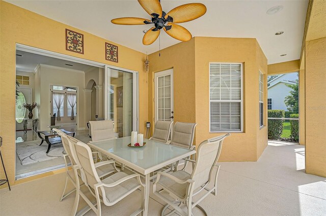 view of patio featuring ceiling fan