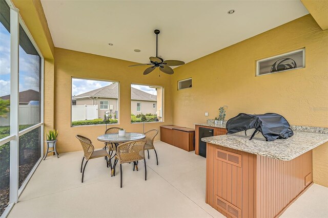 sunroom / solarium with ceiling fan