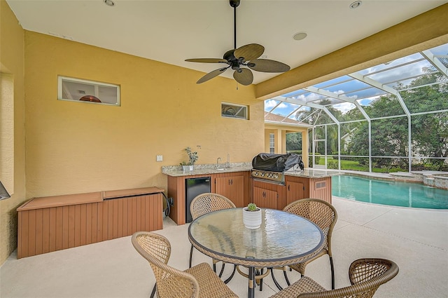 view of patio / terrace with radiator, area for grilling, ceiling fan, and a lanai