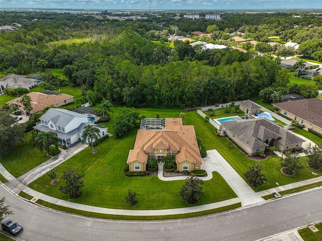 drone / aerial view with a view of trees