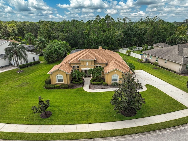 14526 17th Ave E, Bradenton, FL 34212 - mediterranean / spanish home featuring a front yard, stucco siding, and concrete driveway