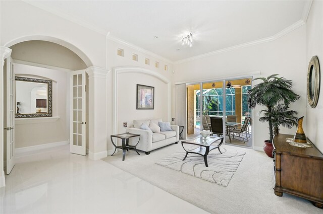 14526 17th Ave E, Bradenton, FL 34212 - living area with french doors, arched walkways, crown molding, and baseboards