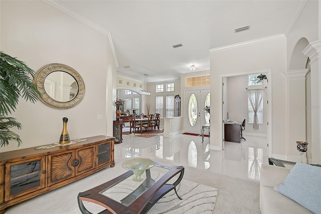 14526 17th Ave E, Bradenton, FL 34212 - living area featuring ornamental molding, carpet floors, decorative columns, and arched walkways
