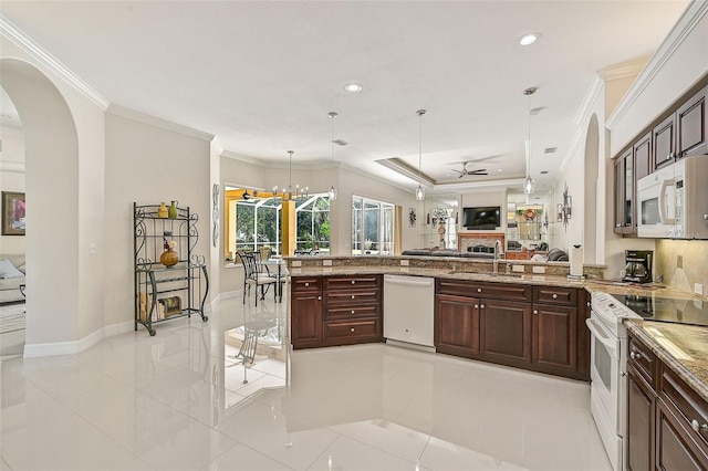 14526 17th Ave E, Bradenton, FL 34212 - kitchen featuring white appliances, open floor plan, a sink, ceiling fan, and pendant lighting