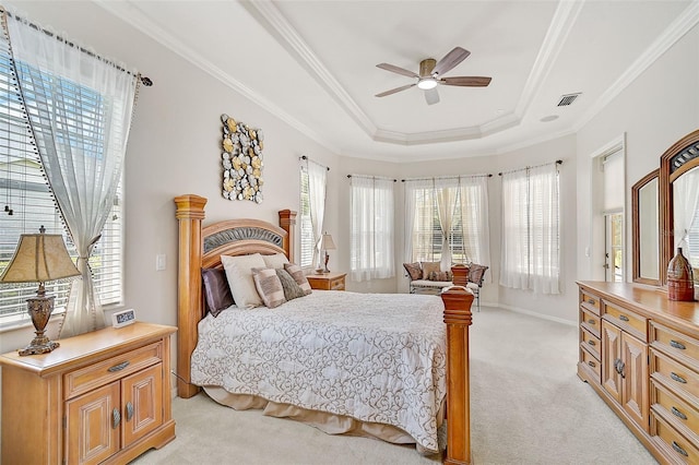 14526 17th Ave E, Bradenton, FL 34212 - bedroom with light carpet, a tray ceiling, ornamental molding, baseboards, and ceiling fan