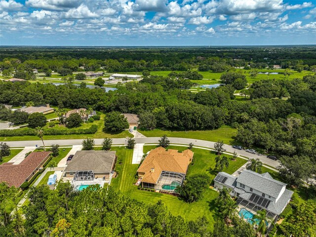 14526 17th Ave E, Bradenton, FL 34212 - bird's eye view of a nearby body of water, a pool area, and a heavily wooded area