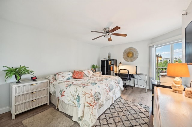 bedroom featuring hardwood / wood-style floors and ceiling fan