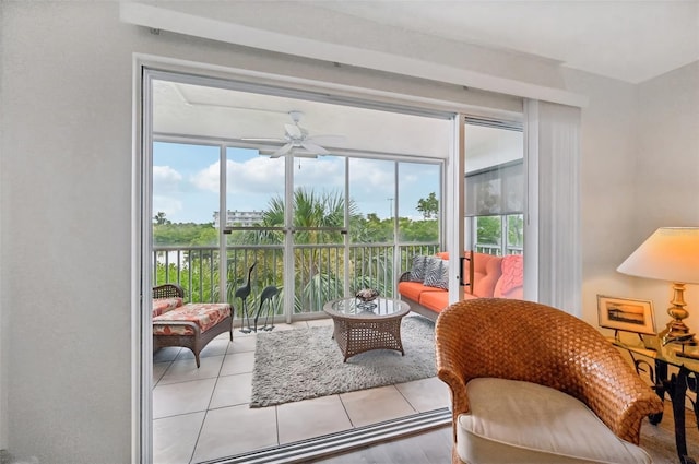 sunroom / solarium featuring ceiling fan