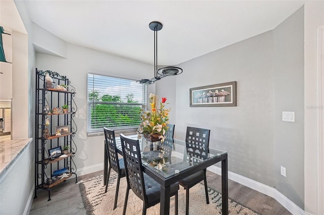 dining area with hardwood / wood-style floors