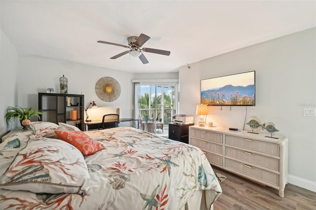 bedroom with access to exterior, wood-type flooring, and ceiling fan