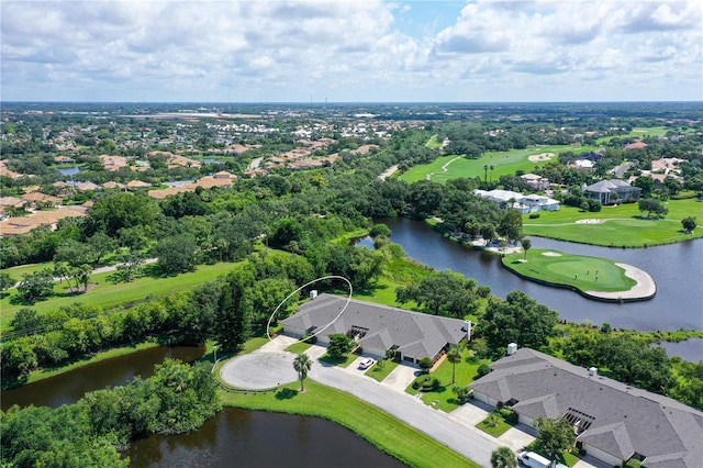 drone / aerial view with a water view and a residential view