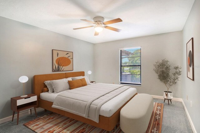 bedroom with ceiling fan and carpet