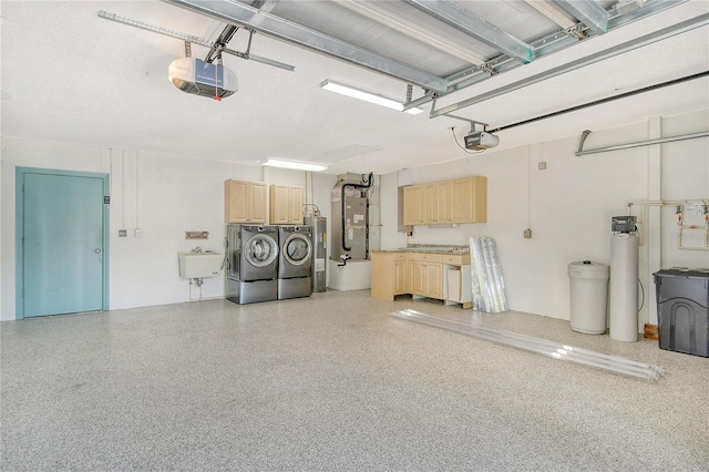 garage featuring a garage door opener, washing machine and dryer, heating unit, and sink