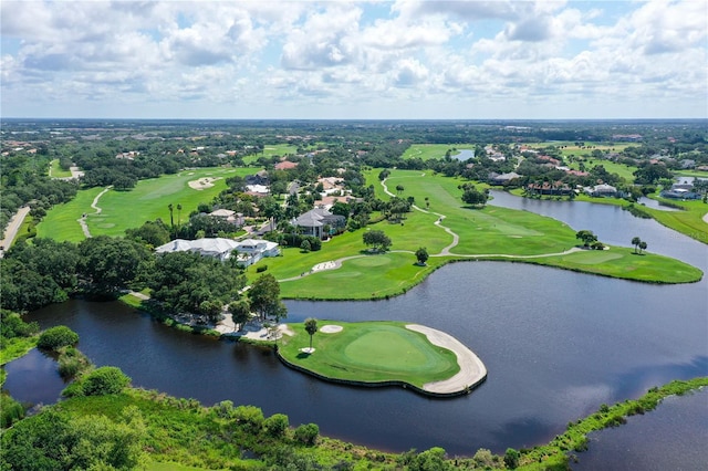 birds eye view of property featuring view of golf course and a water view