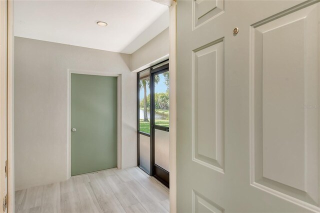 doorway to outside with light hardwood / wood-style floors