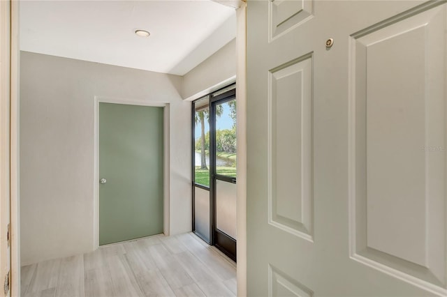 doorway to outside with light wood finished floors