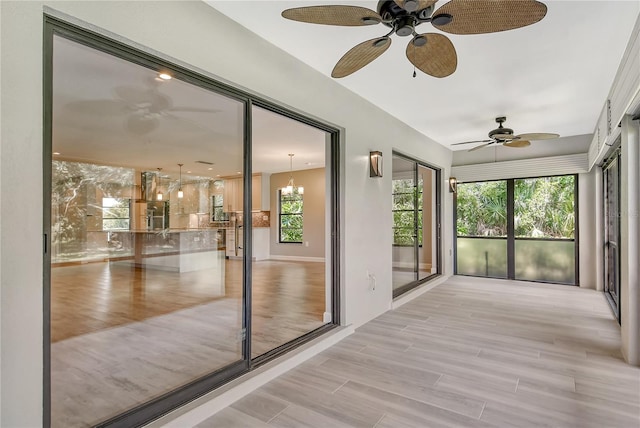 unfurnished sunroom with a notable chandelier