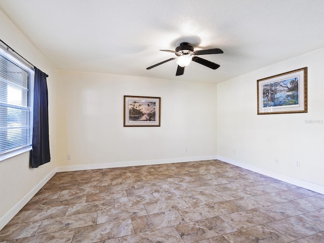 unfurnished room with light tile patterned floors and ceiling fan