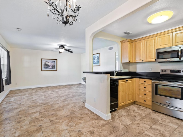 kitchen with kitchen peninsula, appliances with stainless steel finishes, ceiling fan with notable chandelier, and light tile patterned floors