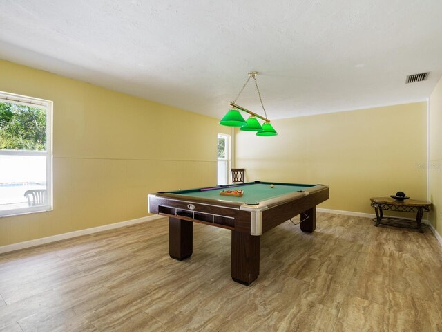 game room with pool table and light hardwood / wood-style floors