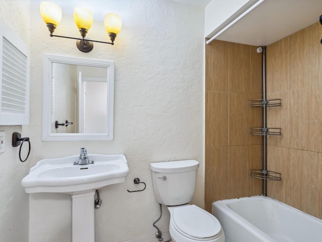 bathroom featuring toilet and shower / tub combination