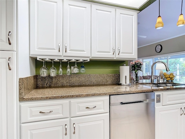 kitchen featuring ornamental molding, stainless steel dishwasher, white cabinetry, and hanging light fixtures