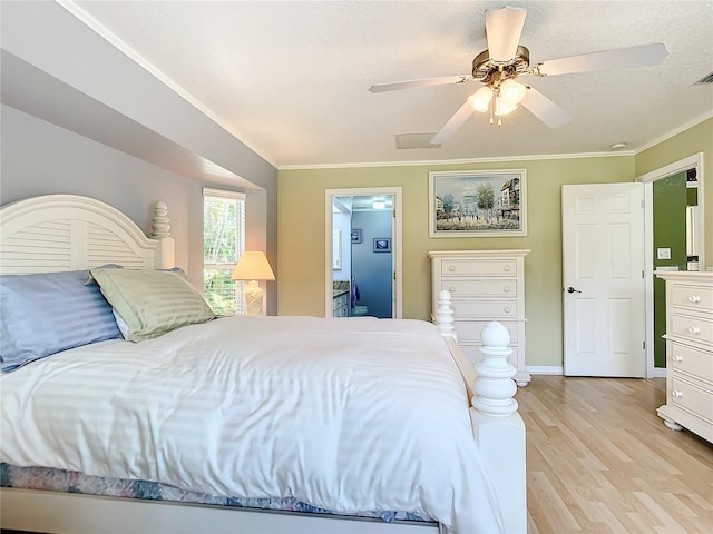 bedroom with light wood-type flooring, ceiling fan, and ornamental molding