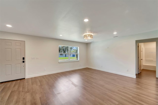 unfurnished room featuring light hardwood / wood-style floors