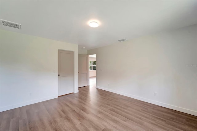 empty room featuring wood-type flooring