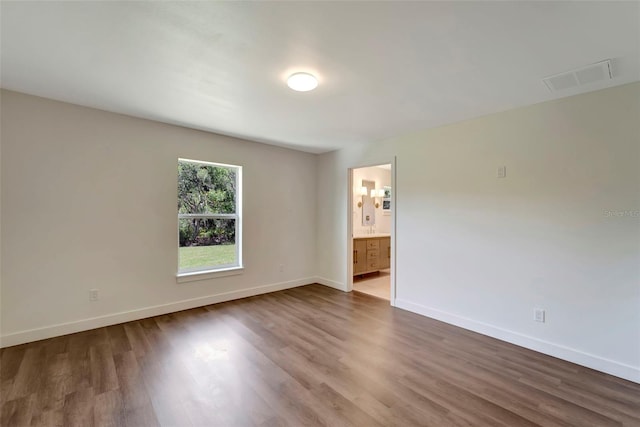 empty room featuring hardwood / wood-style floors