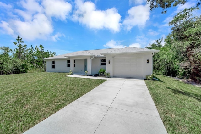 view of front of property with a front lawn and a garage