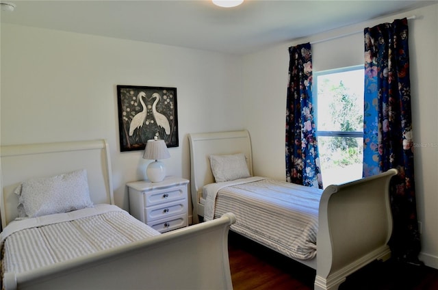 bedroom featuring dark wood-type flooring