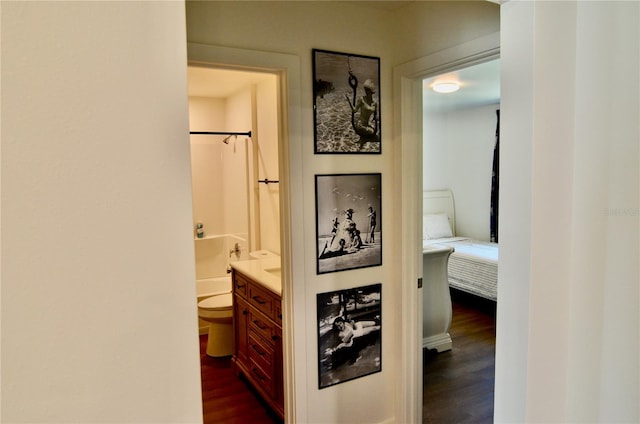 hallway with dark hardwood / wood-style floors