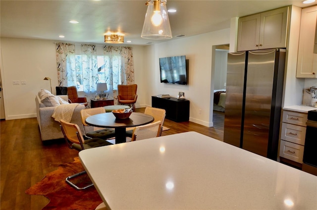 dining area with dark hardwood / wood-style flooring