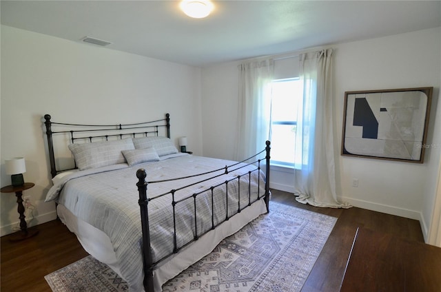 bedroom featuring dark wood-type flooring