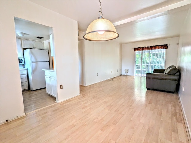 unfurnished living room with light wood-type flooring